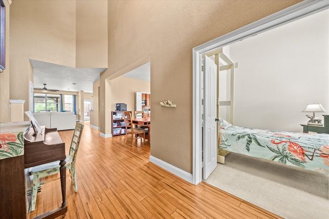 Hallway with light wood-style flooring and baseboards | Image 8