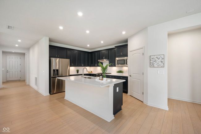 Kitchen has upgraded pullout trays and a pantry | Image 7