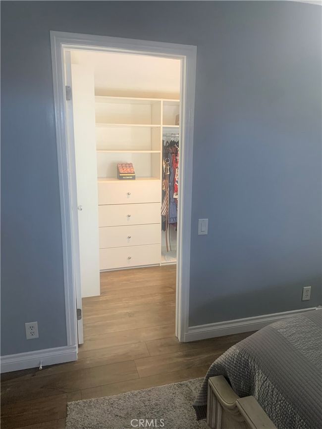 Walk in closet Primary bedroom | Image 18