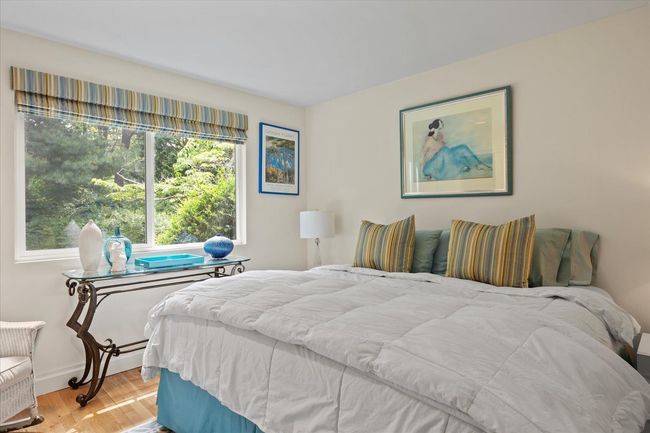 Bedroom featuring baseboards and wood finished floors | Image 17