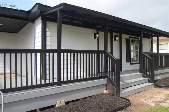 Side porch and front porch. Very inviting. | Image 37