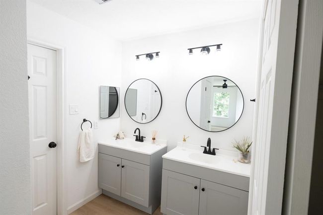Enjoy the newly renovated primary bathroom with modern touches | Image 25