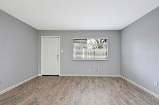 Foyer entrance with light wood finished floors and baseboards | Image 10