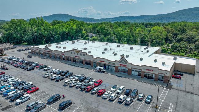Bird's eye view with a wooded view and a mountain view | Image 17