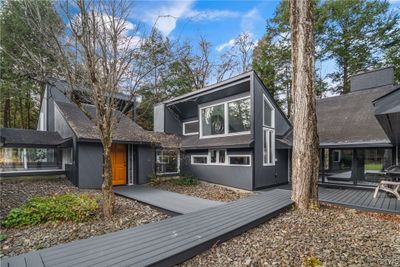 Courtyard leading to areas of relaxation or various entries into the home. | Image 2