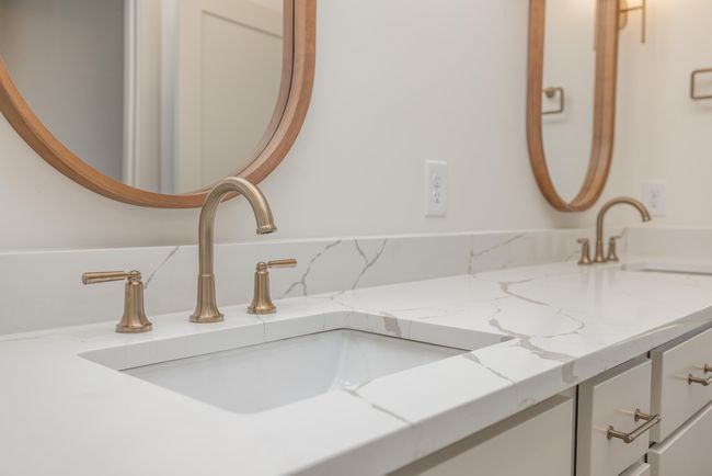 Large Double Vanity, quartz and champagne bronze fixtures and hardware | Image 19
