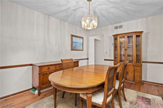 Dining room with light laminate/wood flooring | Image 11