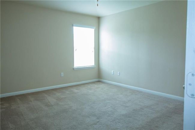 Carpeted spare room featuring baseboards | Image 5