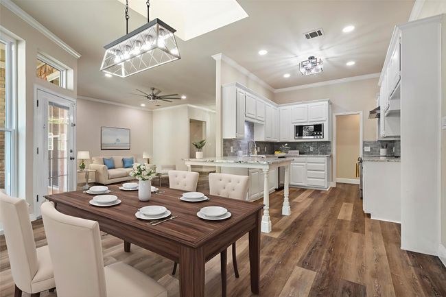 A view of the kitchen and living room from the breakfast area. (This photo has been virtually staged to show it's potential.) | Image 12