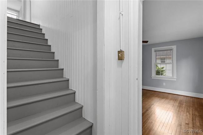 Stairway featuring wood-type flooring and baseboards | Image 17