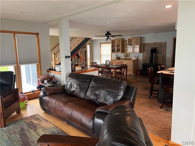 living room view into dining area and stairs to second floor | Image 19
