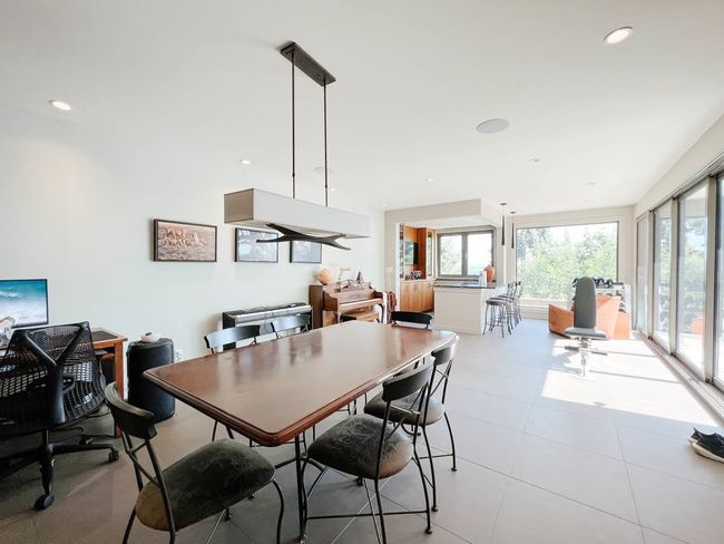Dining space featuring healthy amount of natural light, light tile patterned flooring, and recessed lighting | Image 22