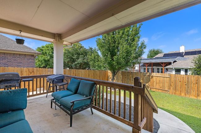 Fenced backyard with grilling area and a patio area | Image 28