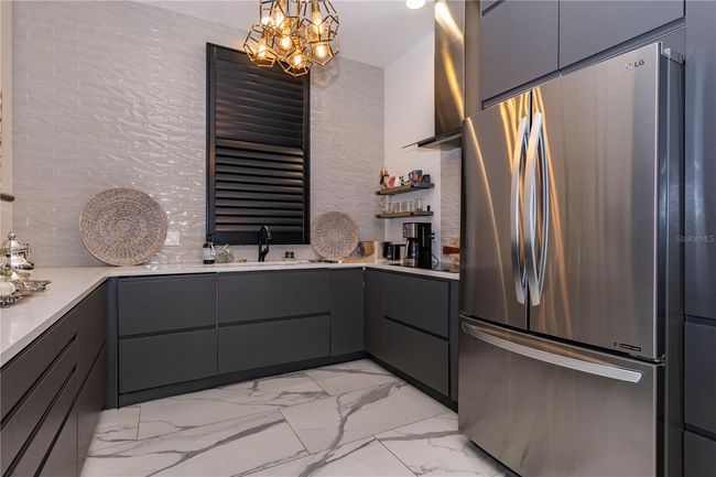 Kitchen w/ stainless steel appliances | Image 11
