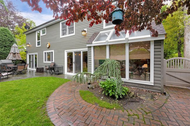 Back of property featuring a lawn, a patio, and a gate | Image 27