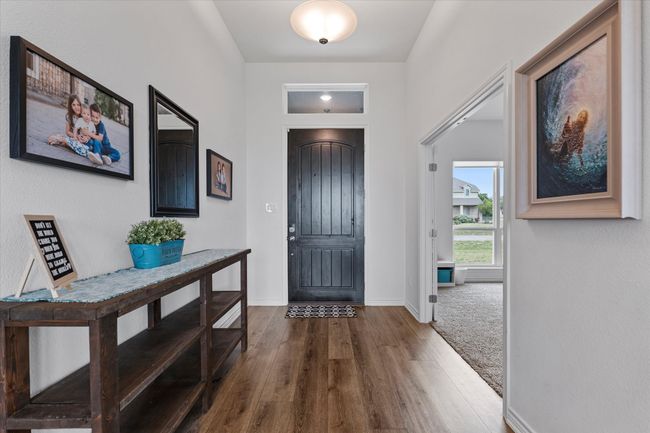 Entryway with wood finished floors and baseboards | Image 6