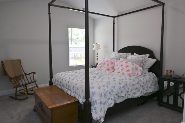 Carpeted bedroom with baseboards | Image 28