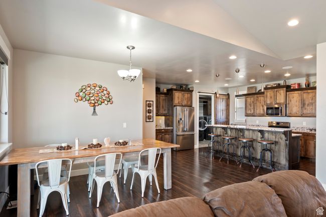 Dining space featuring recessed lighting, dark wood-style flooring, and lofted ceiling | Image 15