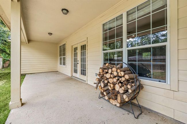 This spacious back patio is perfect for grilling or relaxing in the shade. | Image 32
