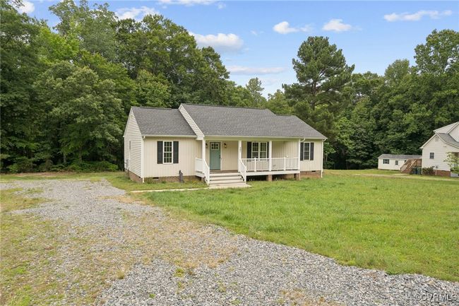 Single story home featuring crawl space, covered porch, driveway, a front yard, and roof with shingles | Image 28
