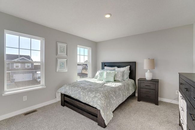 Space is also abundant in each of the home's three secondary bedrooms, all three of which are just steps from the upper-level loft! Photo of model home, color and options will vary. | Image 19