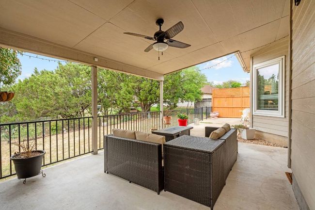 View of patio featuring an outdoor living space, ceiling fan, and a fenced backyard | Image 25