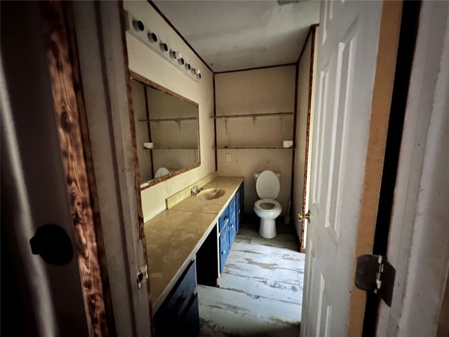 Bathroom with toilet and vanity | Image 17