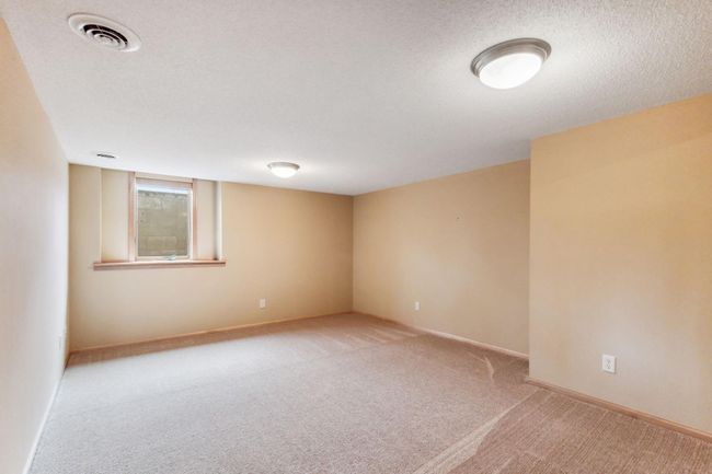 The lower level has 2 large finished rooms. This one with the egress window could be a 5th bedroom, but it really does make a large family recreation room. | Image 22