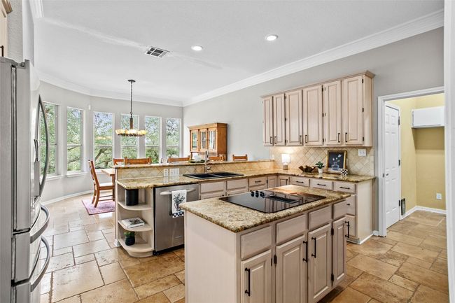 The laundry and garage are to the door on the right | Image 12