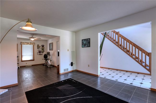 The Dupont flooring is throughout the living room, dining room, and kitchen. | Image 11