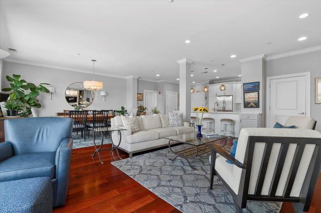 Bedroom featuring a ceiling fan, wood finished floors, baseboards, ornamental molding, and recessed lighting | Image 9