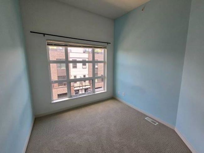 Carpeted empty room featuring baseboards | Image 17