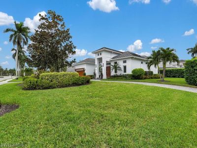 View of front of house with a garage and a front yard | Image 3