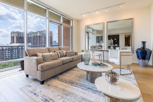 Indulge in luxurious 9th-floor living with breathtaking city views and a modern open-concept design. | Image 6