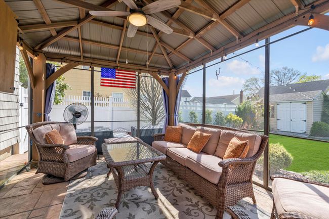 Sunroom with ceiling fan and an outdoor hangout area | Image 14