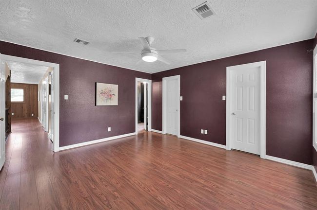 Open door to the right is the primary bathroom. To the left you can see the hallway and into the upstairs flex room | Image 27