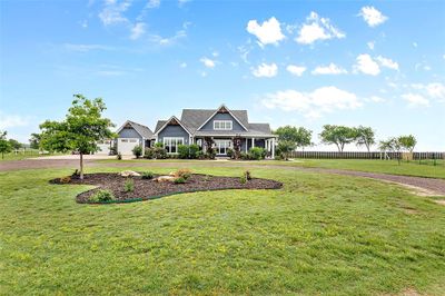 View of front of property featuring a garage and a front yard | Image 2