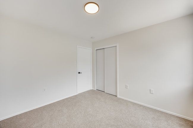 Unfurnished room featuring light carpet and baseboards | Image 27