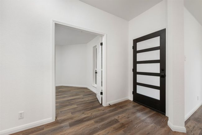 Foyer entrance with dark wood-style flooring and baseboards | Image 11