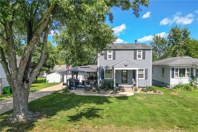 Rear view of property featuring a lawn and a gazebo | Image 3