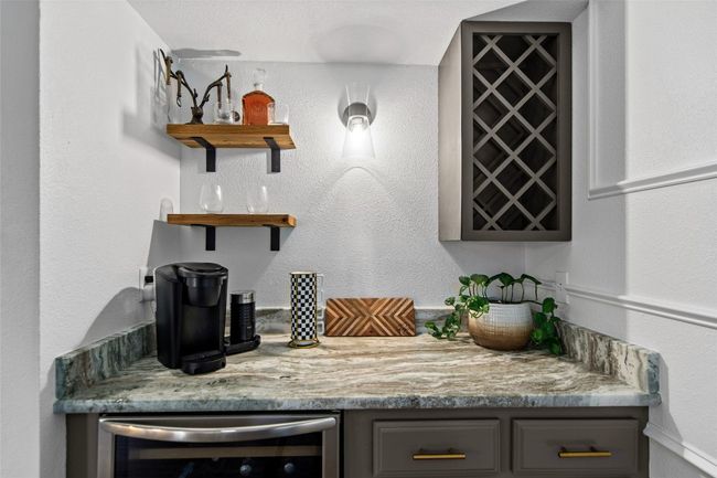 Indoor dry bar featuring beverage cooler | Image 40