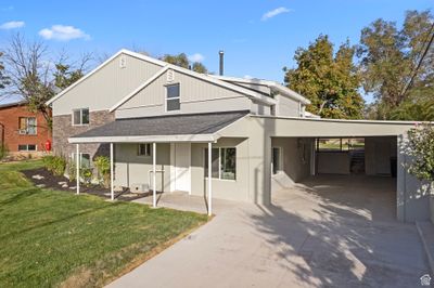 View of front facade with a front lawn and a carport | Image 3