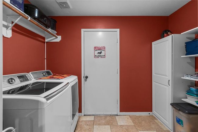 inside laundry room located by kitchen | Image 17