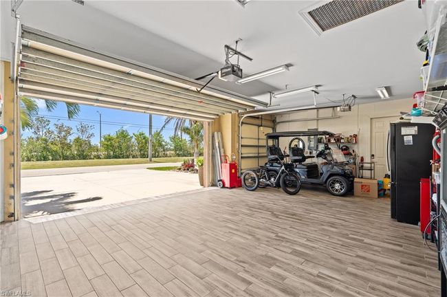 Garage with a garage door opener | Image 35