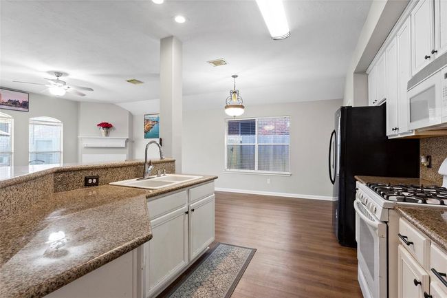 The view of the open Kitchen. The Refrigerator is included with home. | Image 7