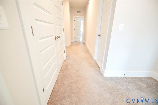 Corridor featuring baseboards and light colored carpet | Image 19