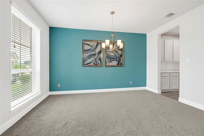 Formal dining adjacent to coffee bar/bar. | Image 4