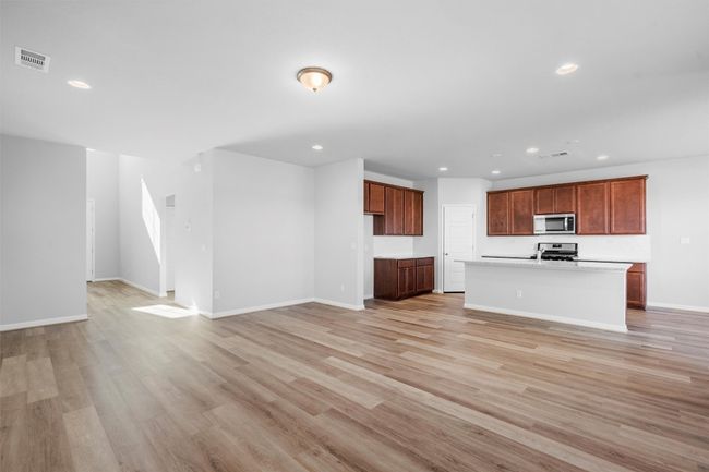 Unfurnished living room featuring recessed lighting and light wood finished floors | Image 7
