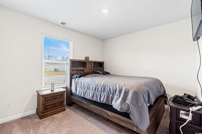 Bedroom with carpet | Image 25