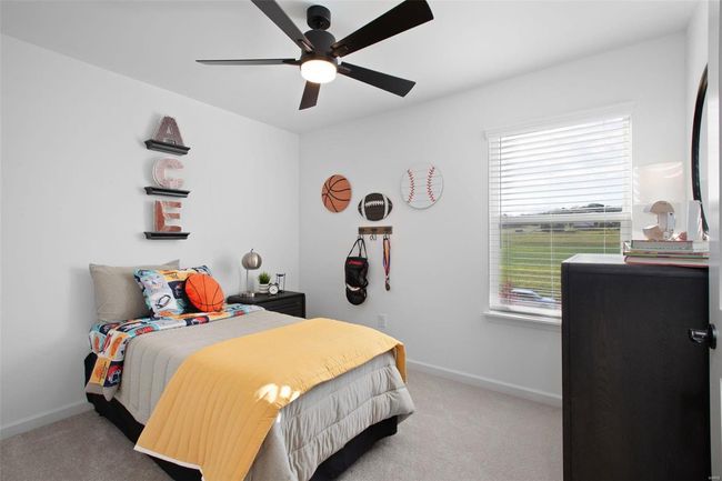 Bedroom featuring ceiling fan and light carpet | Image 23